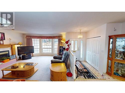 1002 Maple Heights Road, Quesnel, BC - Indoor Photo Showing Living Room With Fireplace