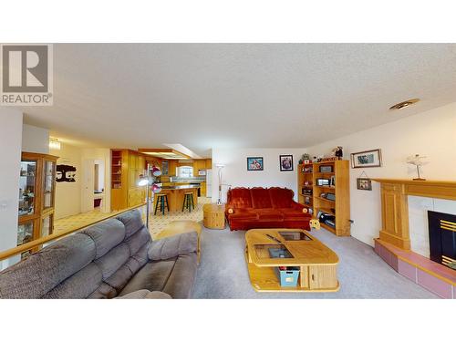 1002 Maple Heights Road, Quesnel, BC - Indoor Photo Showing Living Room With Fireplace