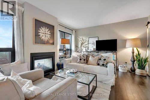 510 - 181 James Street N, Hamilton (Strathcona), ON - Indoor Photo Showing Living Room With Fireplace