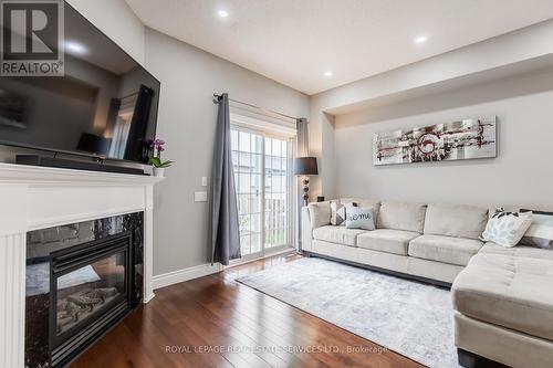 10 - 5080 Fairview Street, Burlington (Appleby), ON - Indoor Photo Showing Living Room With Fireplace