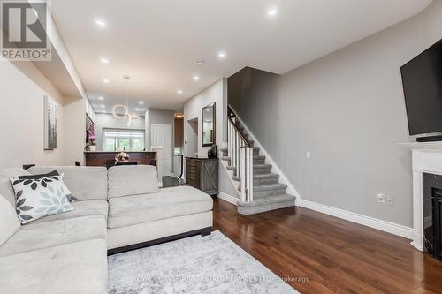 10 - 5080 Fairview Street, Burlington (Appleby), ON - Indoor Photo Showing Living Room With Fireplace