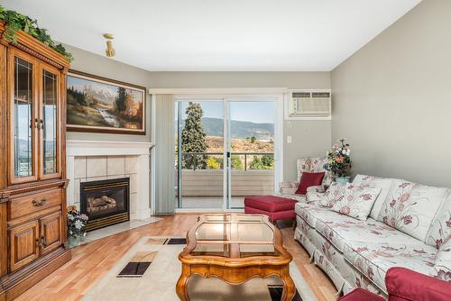 102-3808 35 Avenue, Vernon, BC - Indoor Photo Showing Living Room With Fireplace