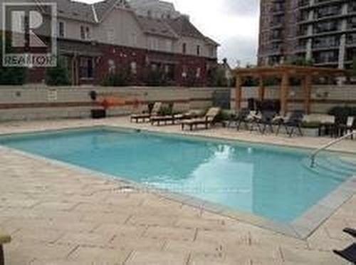 310 - 2391 Central Park Drive, Oakville (Uptown Core), ON - Outdoor With In Ground Pool