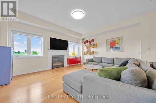 22 Jenkins Street, East Luther Grand Valley, ON - Indoor Photo Showing Living Room With Fireplace