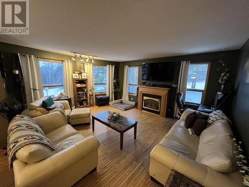 15 Walsh Road, Fort Nelson, BC - Indoor Photo Showing Living Room With Fireplace