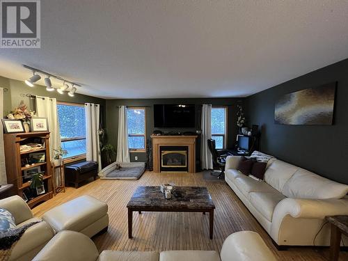 15 Walsh Road, Fort Nelson, BC - Indoor Photo Showing Living Room With Fireplace