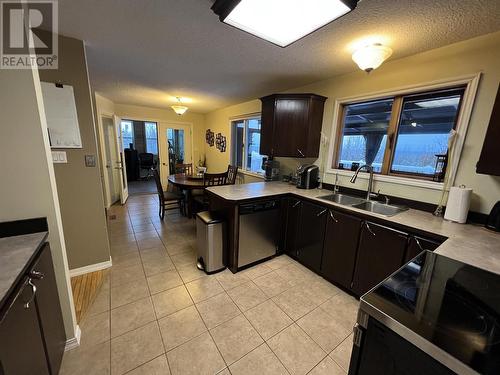 15 Walsh Road, Fort Nelson, BC - Indoor Photo Showing Kitchen With Double Sink