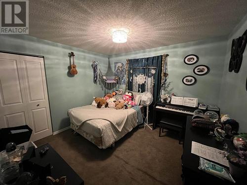 15 Walsh Road, Fort Nelson, BC - Indoor Photo Showing Bedroom