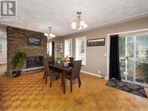 2999 Charella Drive, Prince George, BC - Indoor Photo Showing Dining Room With Fireplace