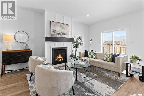 58 900 St Andrews Lane, Warman, SK - Indoor Photo Showing Living Room With Fireplace