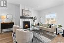 58 900 St Andrews Lane, Warman, SK  - Indoor Photo Showing Living Room With Fireplace 