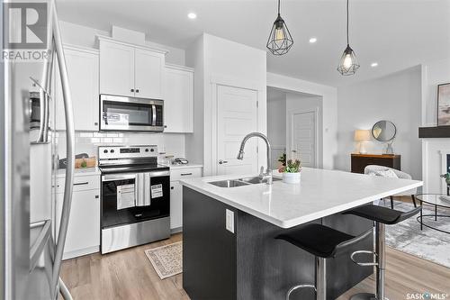 58 900 St Andrews Lane, Warman, SK - Indoor Photo Showing Kitchen With Double Sink With Upgraded Kitchen