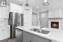 57 900 St Andrews Lane, Warman, SK  - Indoor Photo Showing Kitchen With Double Sink 