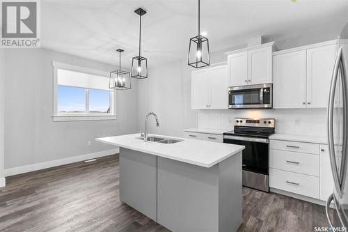 57 900 St Andrews Lane, Warman, SK - Indoor Photo Showing Kitchen With Double Sink With Upgraded Kitchen