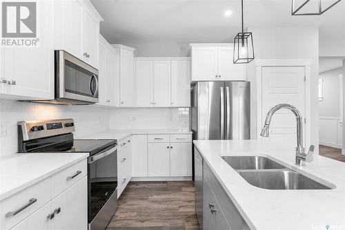 57 900 St Andrews Lane, Warman, SK - Indoor Photo Showing Kitchen With Double Sink With Upgraded Kitchen