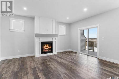 57 900 St Andrews Lane, Warman, SK - Indoor Photo Showing Living Room With Fireplace