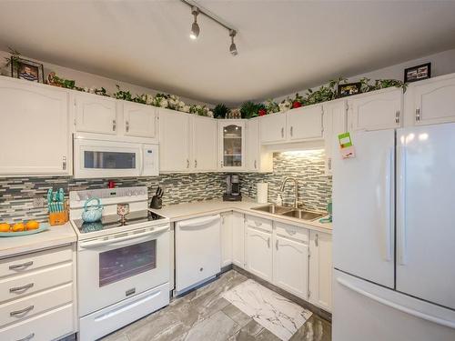 1-11222 Quinpool Road, Summerland, BC - Indoor Photo Showing Kitchen With Double Sink