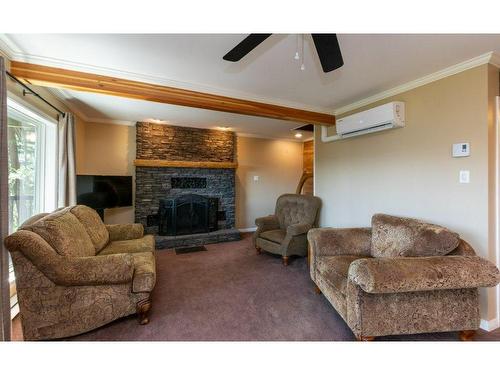 7730 Columbia Drive, Anglemont, BC - Indoor Photo Showing Living Room With Fireplace