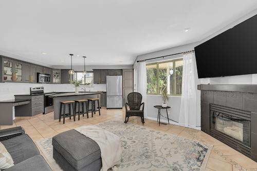 3945 Suncrest Court, Kelowna, BC - Indoor Photo Showing Living Room With Fireplace