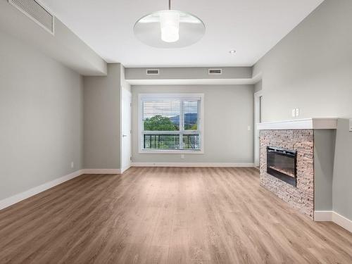 405-1883 Water Street, Kelowna, BC - Indoor With Fireplace
