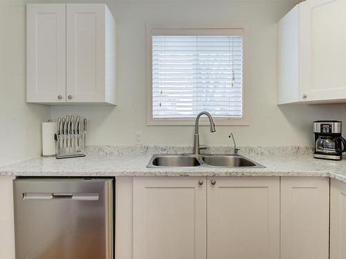 131-133 Wyndham Crescent, Kelowna, BC - Indoor Photo Showing Kitchen With Double Sink