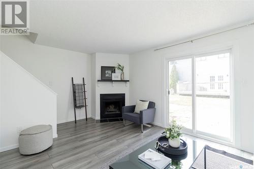 1303 145 Sandy Court, Saskatoon, SK - Indoor Photo Showing Living Room With Fireplace