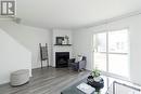 1303 145 Sandy Court, Saskatoon, SK  - Indoor Photo Showing Living Room With Fireplace 