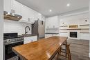 104 Spadina Avenue|Unit #Unit 1, Hamilton, ON  - Indoor Photo Showing Kitchen With Fireplace 