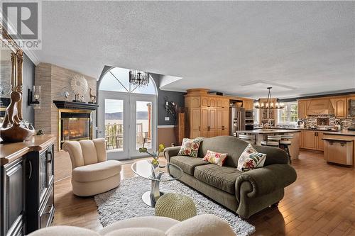 27 Thomas Lane East, Campbellton, NB - Indoor Photo Showing Living Room With Fireplace