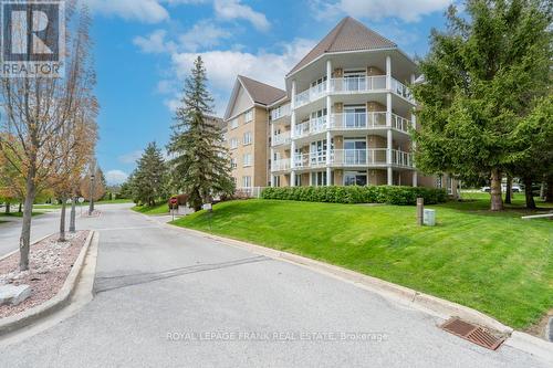 209 - 51 Rivermill Boulevard, Kawartha Lakes, ON - Outdoor With Balcony With Facade