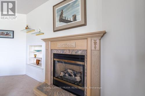 209 - 51 Rivermill Boulevard, Kawartha Lakes, ON - Indoor Photo Showing Other Room With Fireplace