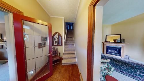 1880A Kootenay Avenue, Rossland, BC - Indoor Photo Showing Other Room With Fireplace