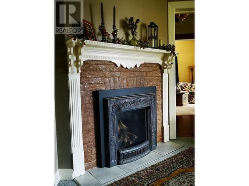 1880A Kootenay  Avenue, Rossland, BC - Indoor Photo Showing Other Room With Fireplace