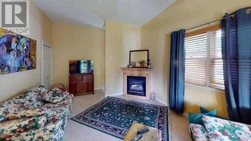 1880A Kootenay  Avenue, Rossland, BC - Indoor Photo Showing Bedroom With Fireplace