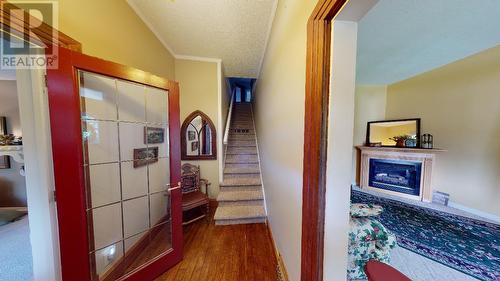 1880A Kootenay  Avenue, Rossland, BC - Indoor Photo Showing Other Room With Fireplace