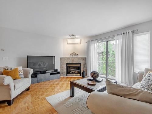Living room - 3D-7031 Rue Louis-Hébert, Montréal (Lasalle), QC - Indoor Photo Showing Living Room With Fireplace