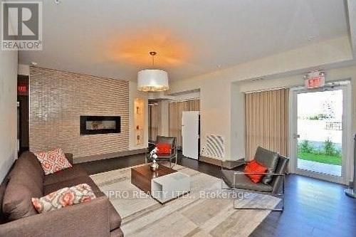 114 - 570 Lolita Gardens, Mississauga, ON - Indoor Photo Showing Living Room With Fireplace
