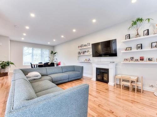 Living room - 380 Rue Fairfield, Longueuil (Greenfield Park), QC - Indoor Photo Showing Living Room With Fireplace