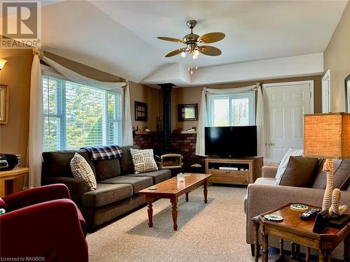 Spacious living room with loads of natural light and walkout to wrap-around decking. - 5 Mill Point Road, North Bruce Peninsula, ON - Indoor Photo Showing Living Room