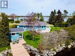 Property offers a private rear yard area and water views on both sides. - 