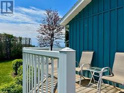 Low maintenance exterior including board/batten siding, aluminum soffit and fascia and newer roof offers more time to just enjoy waterfront cottage life. - 