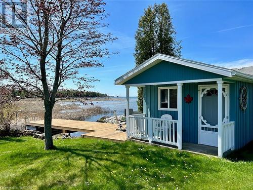 10ft x 12ft shore side bunkie that is full insulated and heated offering an extra bedroom or separate office or entertainment area. - 5 Mill Point Road, North Bruce Peninsula, ON - Outdoor With Body Of Water