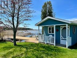 10ft x 12ft shore side bunkie that is full insulated and heated offering an extra bedroom or separate office or entertainment area. - 