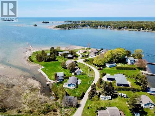 Mill Point community consists of 11 individual waterfront properties who share 1/11 individual ownership of the private road, private boat launch, and extra water access point. - 5 Mill Point Road, North Bruce Peninsula, ON - Outdoor With Body Of Water With View