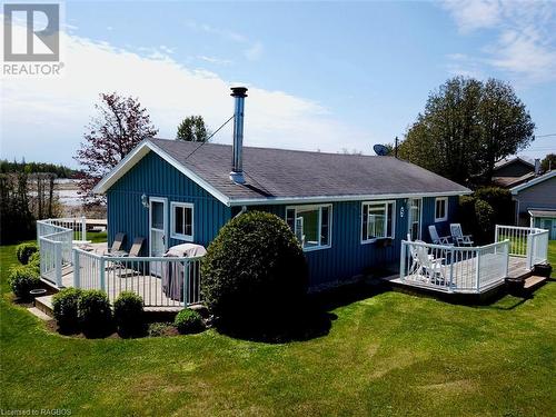Now let's have a look inside 5 Mill Point. - 5 Mill Point Road, North Bruce Peninsula, ON - Outdoor With Deck Patio Veranda