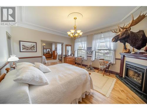 120 Wattsville Road, Cranbrook, BC - Indoor Photo Showing Bedroom With Fireplace