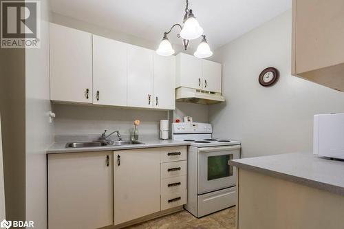 175 Haig Road Unit# 103, Belleville, ON - Indoor Photo Showing Kitchen With Double Sink