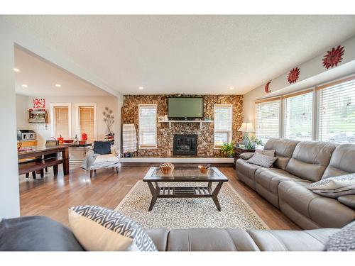 2308 6Th Street N, Cranbrook, BC - Indoor Photo Showing Living Room With Fireplace