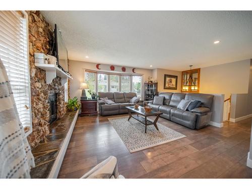 2308 6Th Street N, Cranbrook, BC - Indoor Photo Showing Living Room With Fireplace