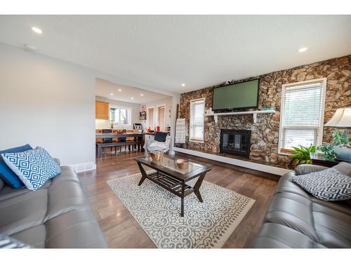 2308 6Th Street N, Cranbrook, BC - Indoor Photo Showing Living Room With Fireplace